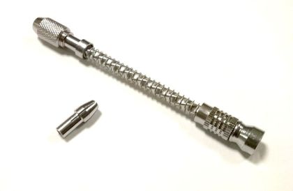 Hand drill with spring return